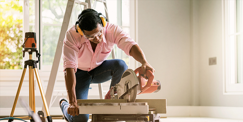 contractor hand use sawing machine wood work house renovation