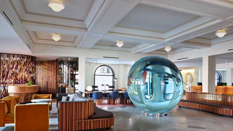 View of the 21c Museum Hotel lobby area with pool table and lounge chairs