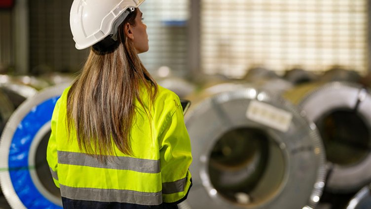 Back of woman worker managing in industry factory