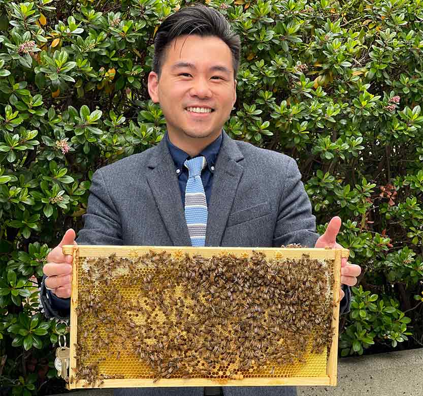 Brandon with his new initiative, a beehive at Post Montgomery Center in San Francisco, CA