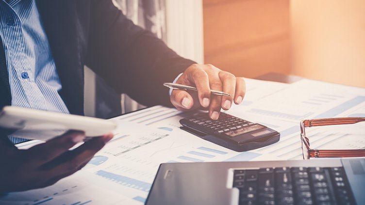 businessman using a calculator