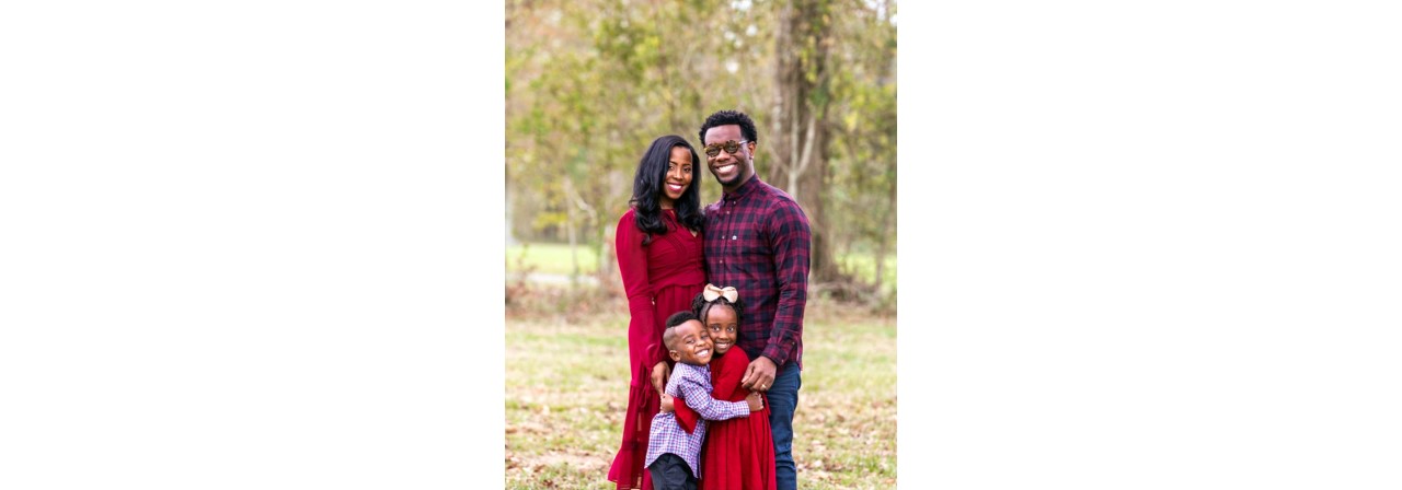 Giselle Battley with her husband and kids(they all are smiling)